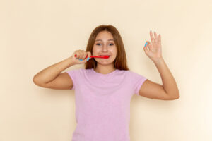 Safe toothpaste for orthodontic patients being used with braces