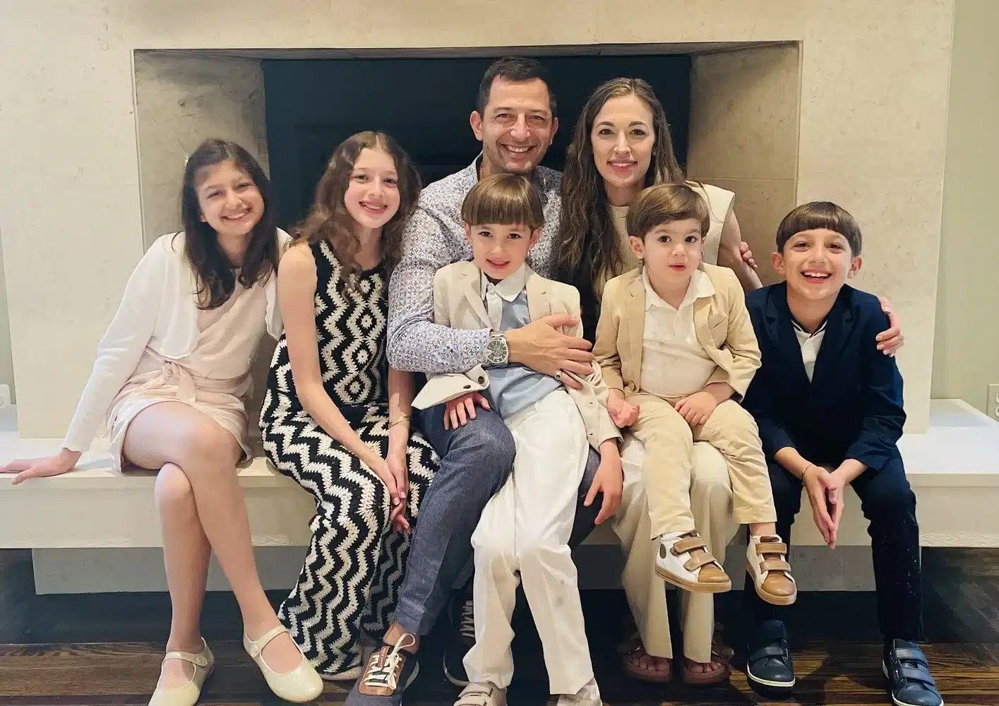 Dr. Eli Halabi, an orthodontist in Brooklyn posing with his beautiful wife and 5 children
